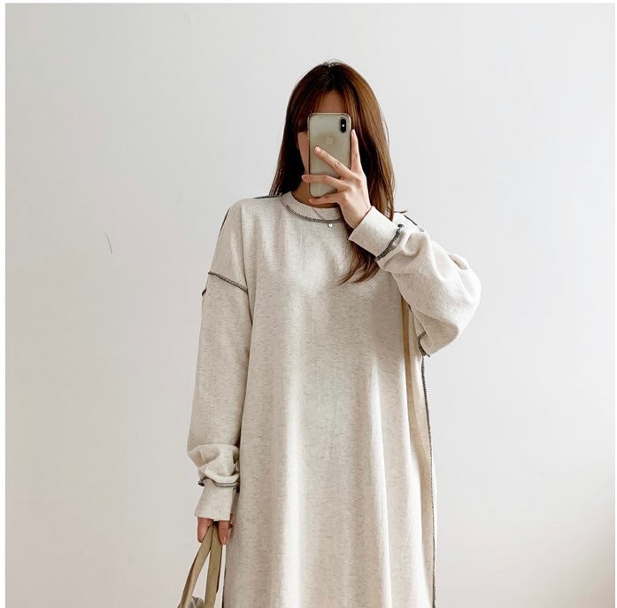 Mirror selfie showing the full-length fit of the oversized sweater dress and its loose silhouette